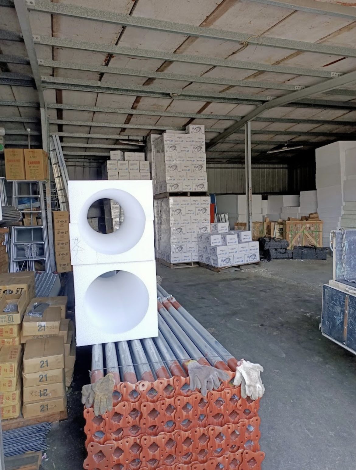 Steel pipe and boxed nails in the warehouse