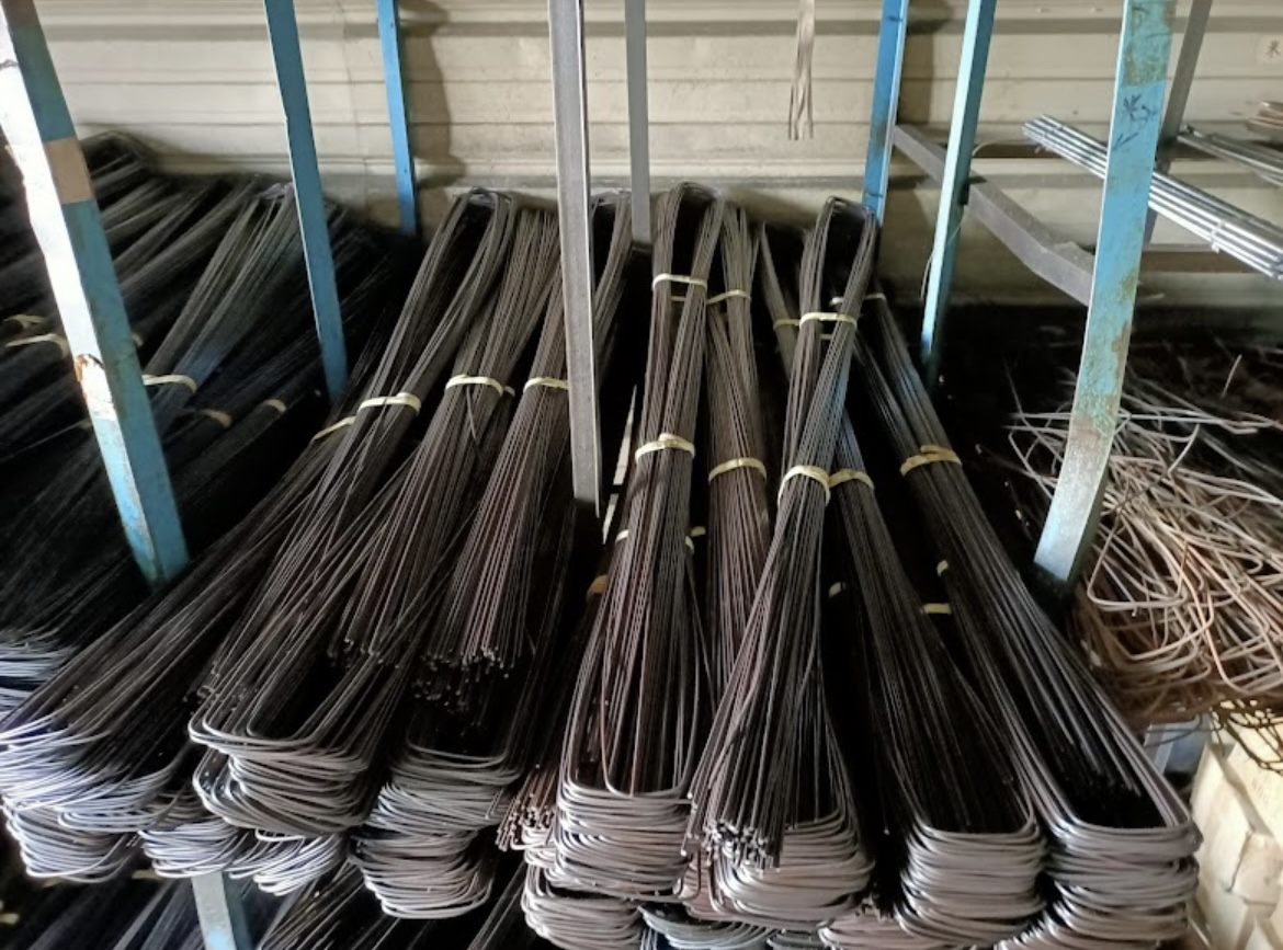 Coils of tie wire and bent stock in the warehouse